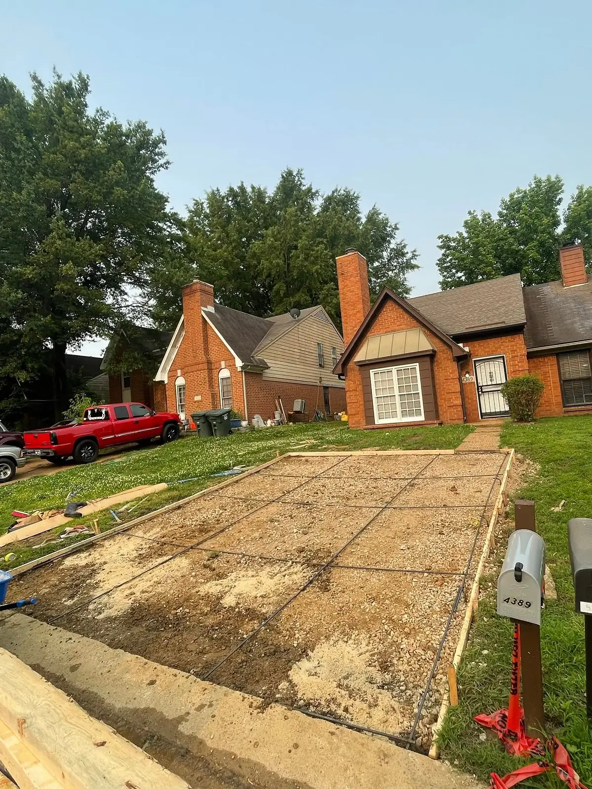 Driveway excavated and graded back to a clean sand base
