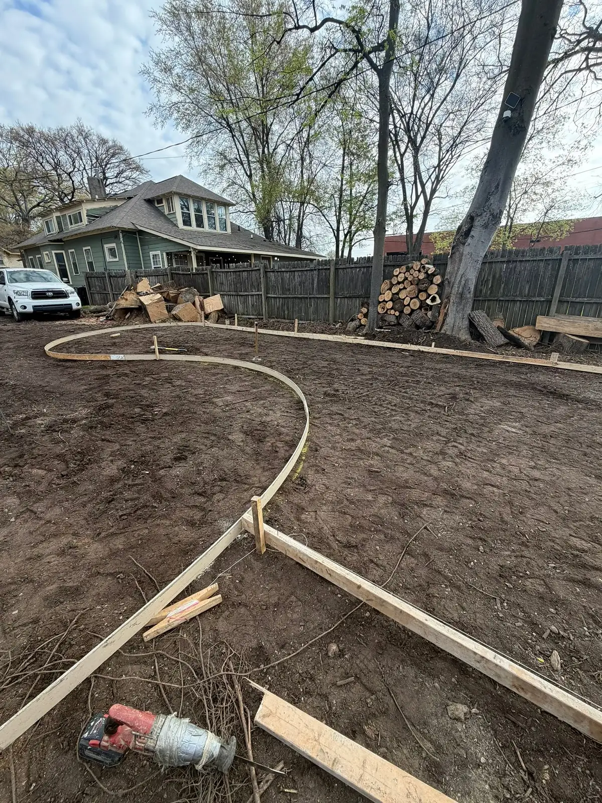 Flexible timber form bent into a curve and staked before the pour