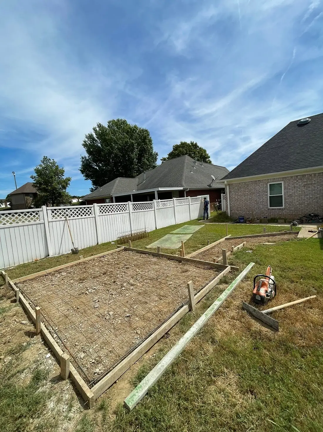 Large rectangular patio forms set out across a back garden