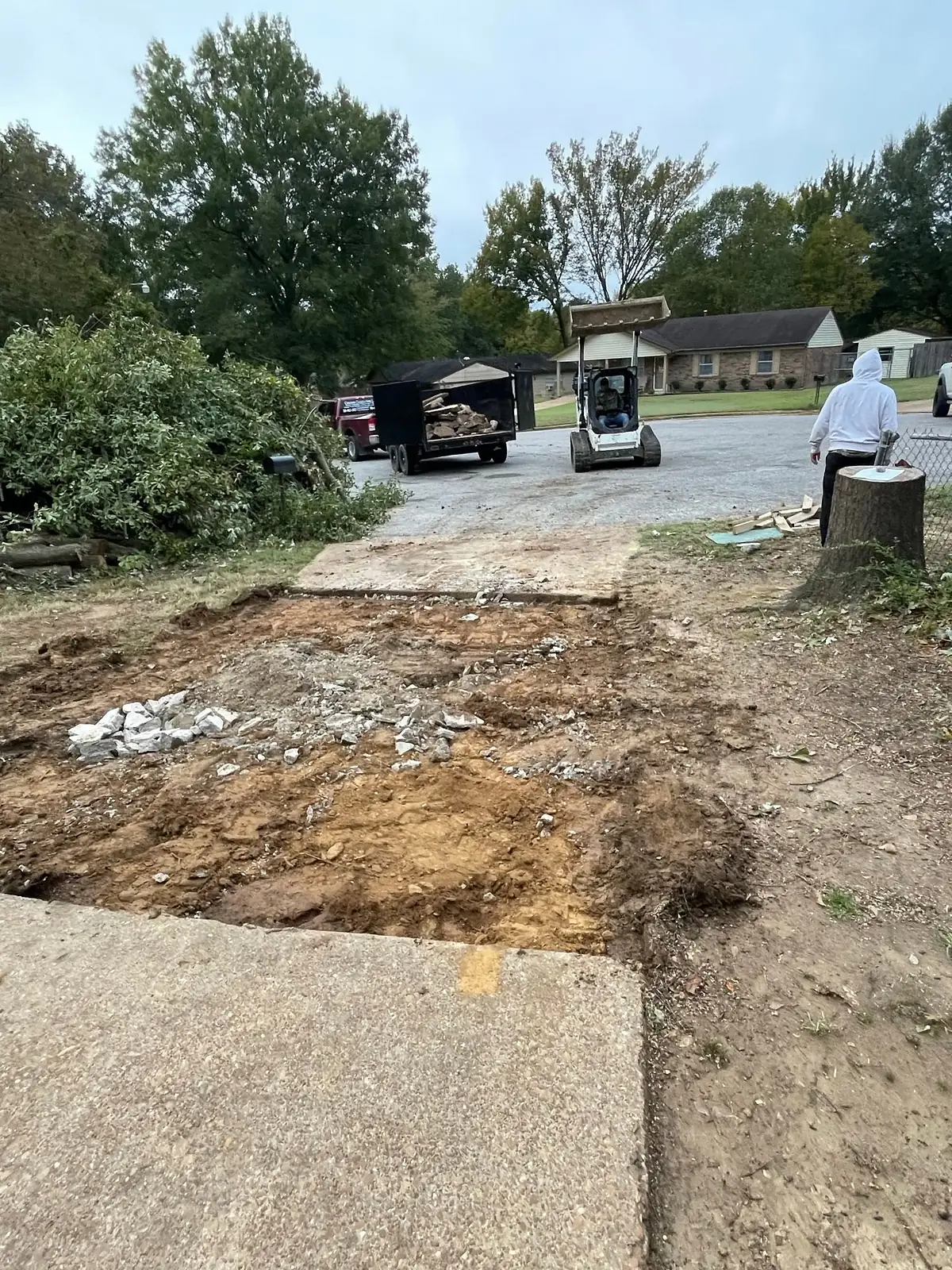 Broken out section of driveway showing the depth of the old slab