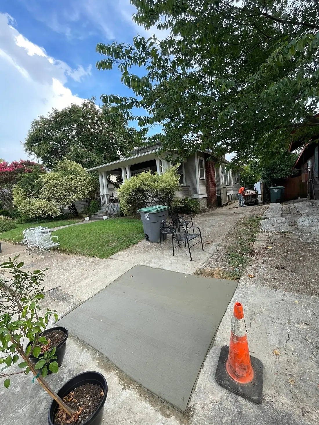 Newly poured concrete section joining an older driveway