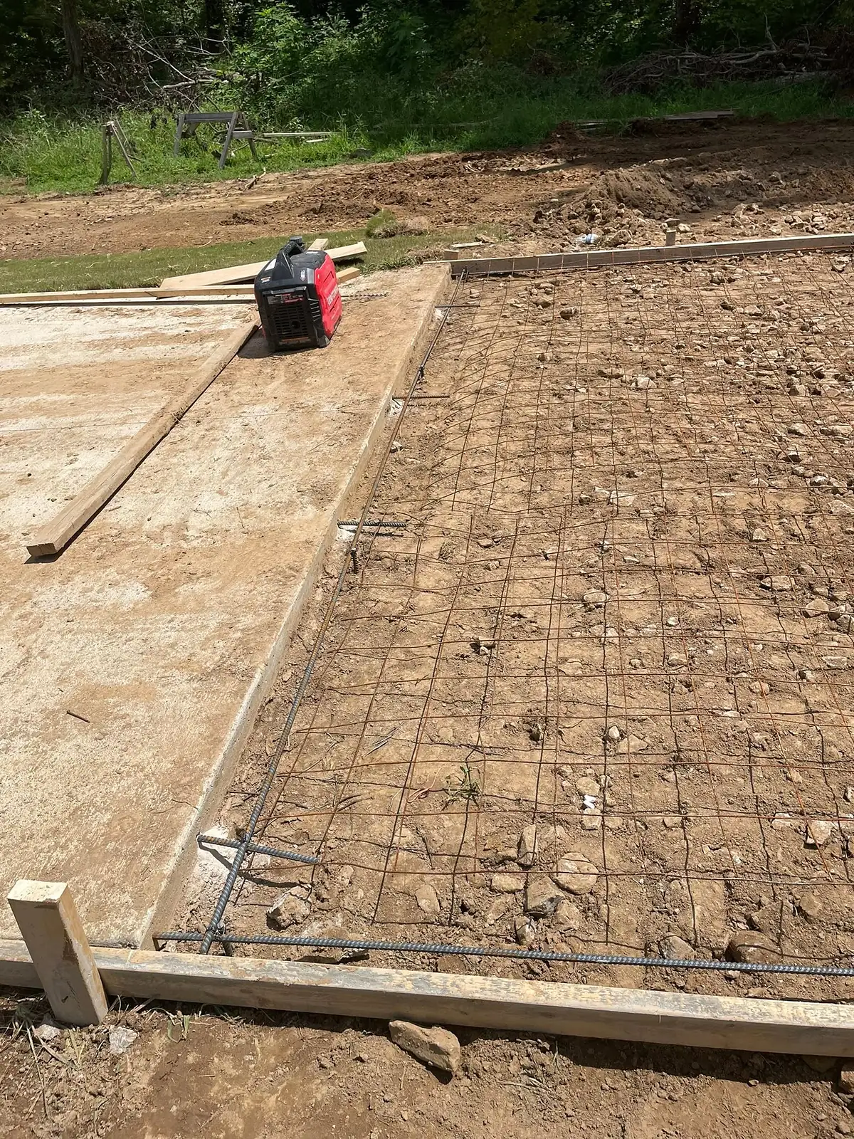 Reinforcing mesh laid out across a large formed slab area