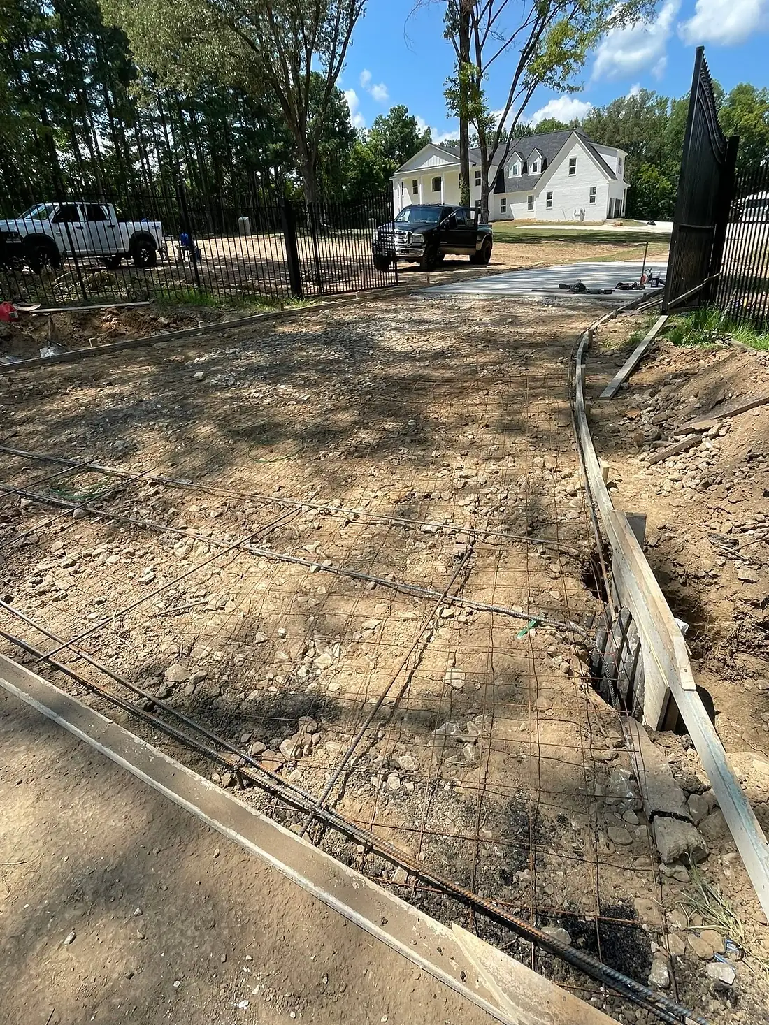 Rebar grid tied across a large residential foundation pad