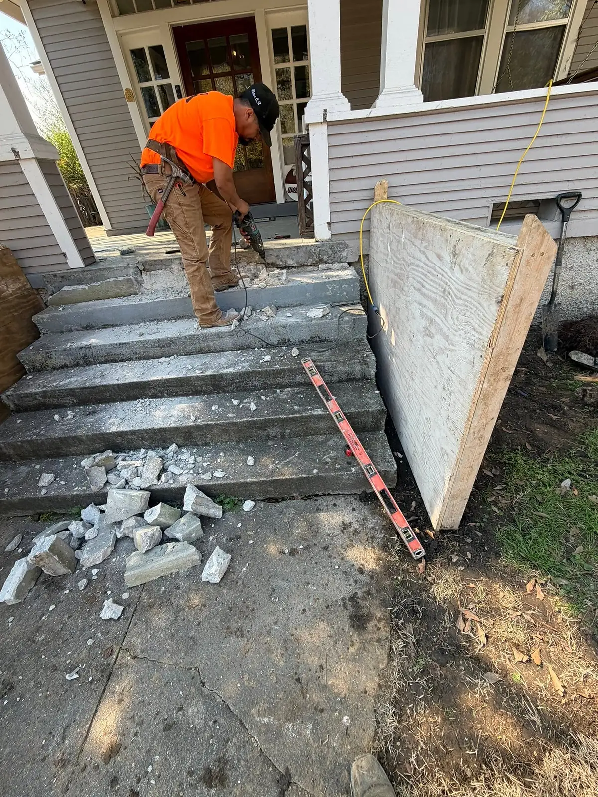 Old concrete steps broken up with a jackhammer before the rebuild