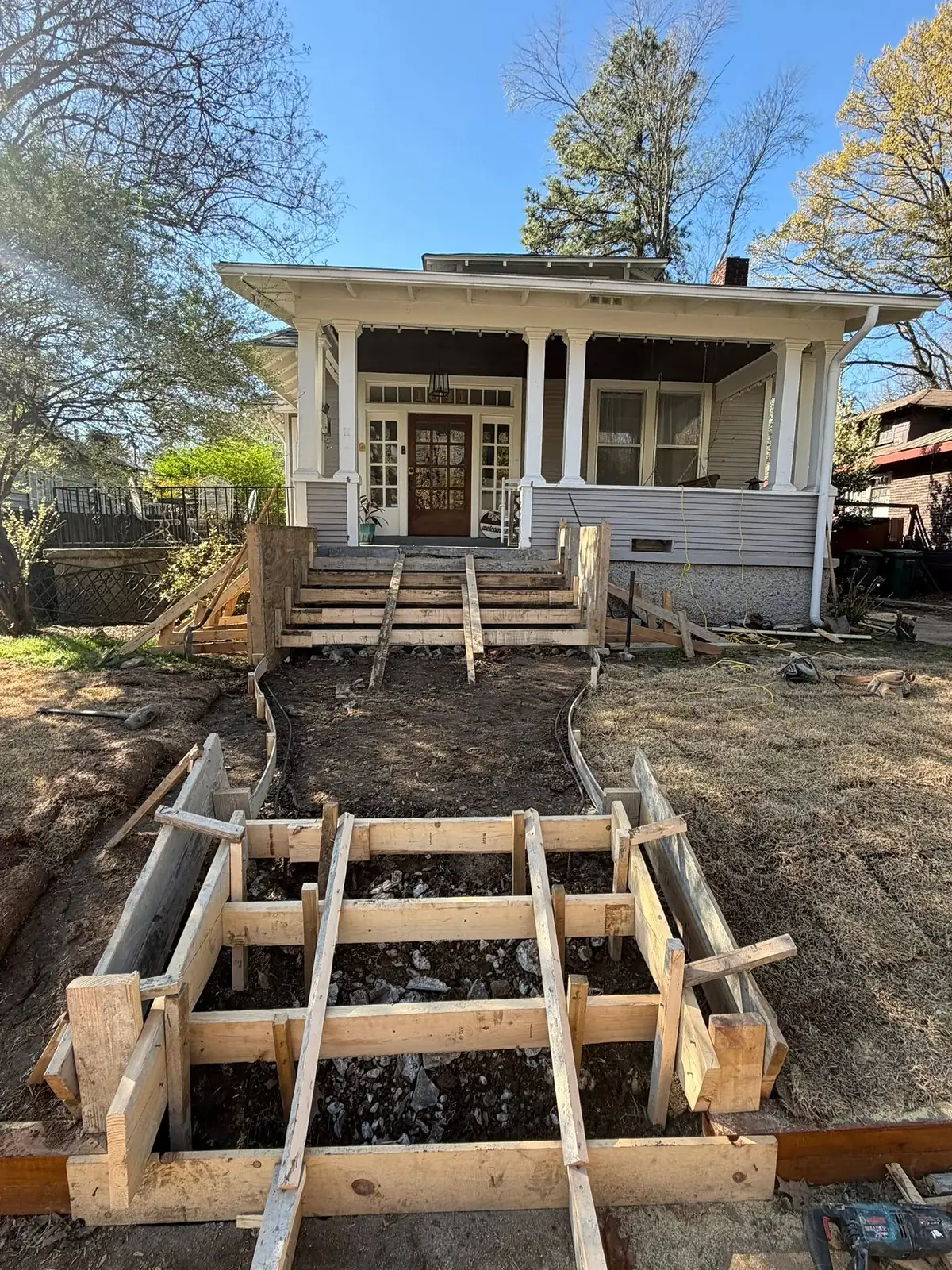 Stepped timber formwork built for a new set of concrete front steps